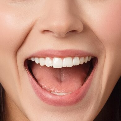 Close-up portrait of surprised beautiful girl holding her head in amazement and open-mouthed. Over white background.